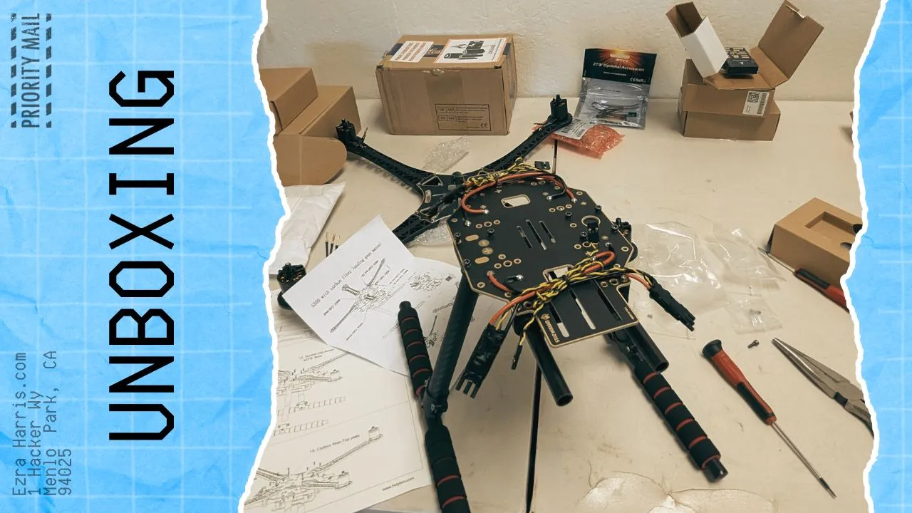 Partly assembled drone frame with wiring and foam landing legs on a table, with manuals, tools, boxes, and UNBOXING text