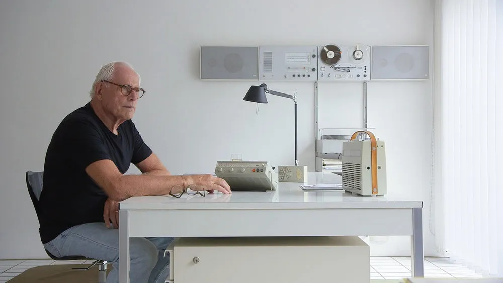 Dieter Rams sitting at his desk from the documentary "Rams"